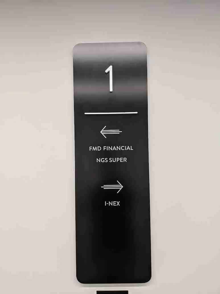 Directional wayfinding sign inside an Adelaide facility